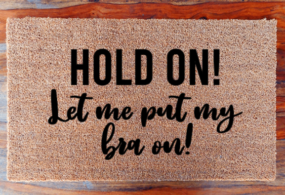 Hold on! Let me put my bra on! - Doormat